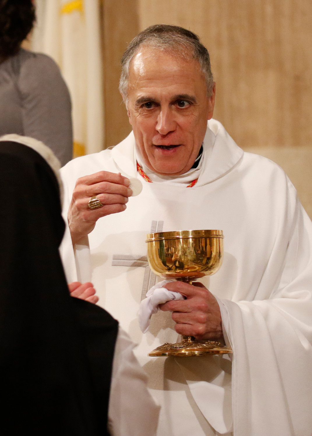 Cardinal Daniel N. DiNardo of Galveston-Houston, president of the U.S. Conference of Catholic Bishops, distributes Communion during the opening Mass of the National Prayer Vigil for Life Jan. 17 at the Basilica of the National Shrine of the Immaculate Conception in Washington.